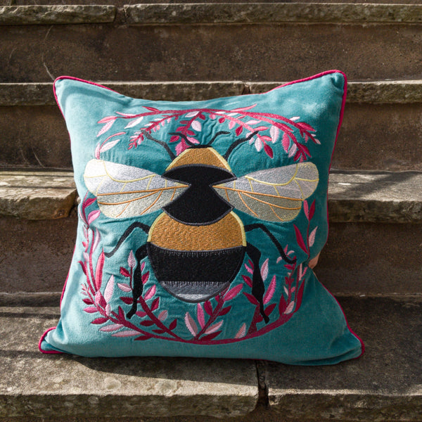 Velvet blue embroidered bumble bee cushion